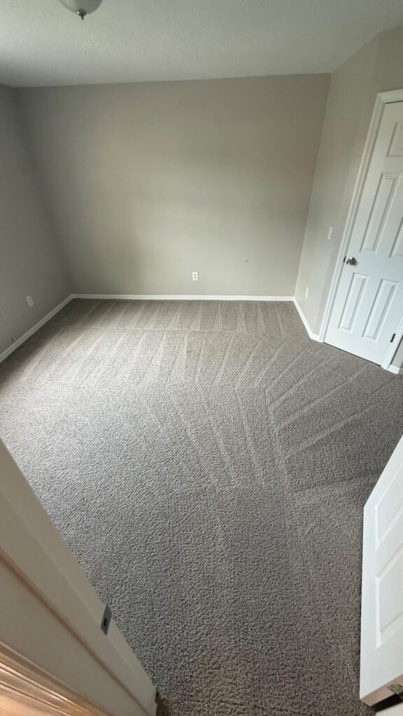 Freshly cleaned bedroom carpet with grooming lines in a Lake Mary, FL home