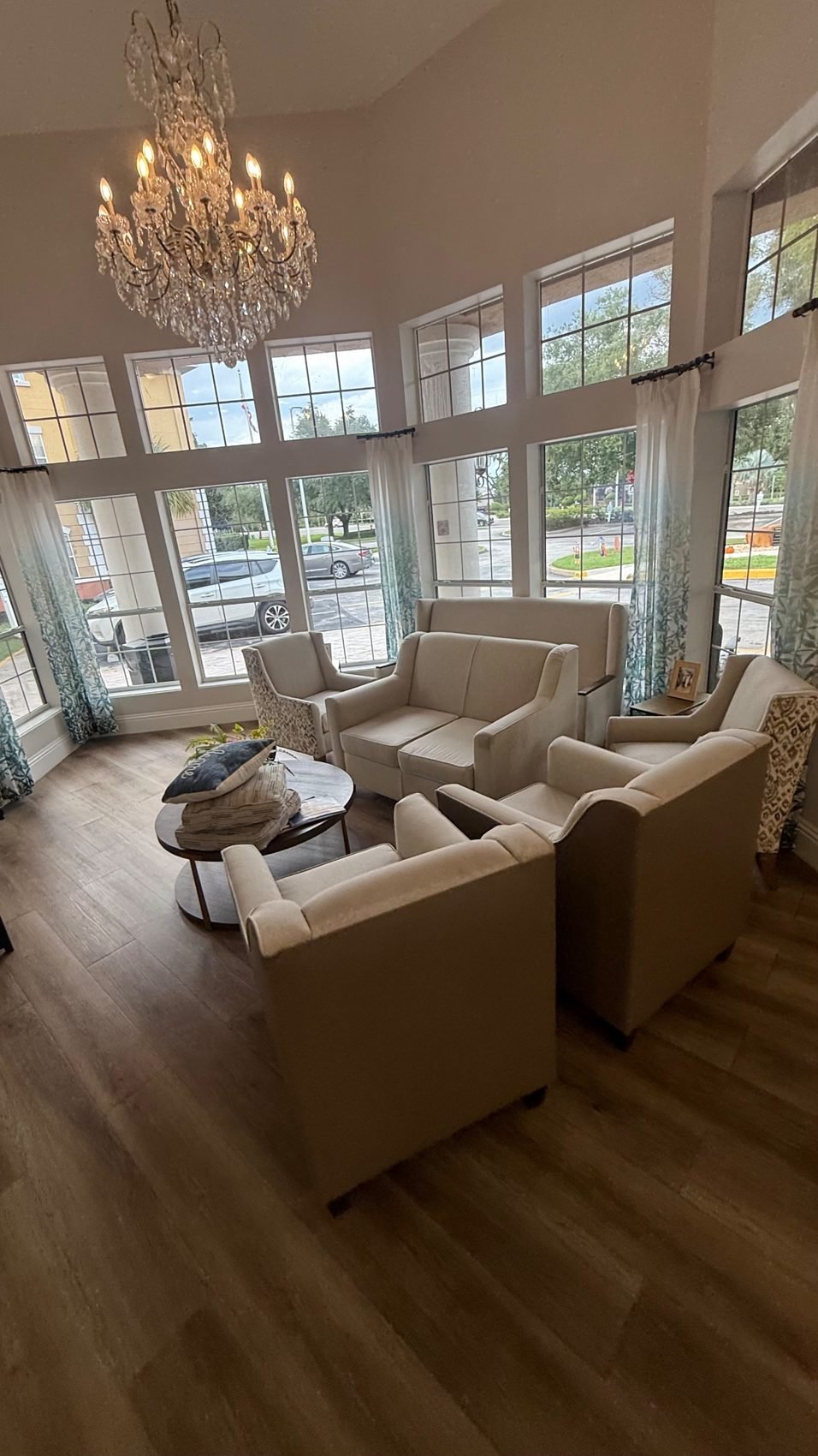 Clean lobby sofas and armchairs at a senior living community in Sanford, FL